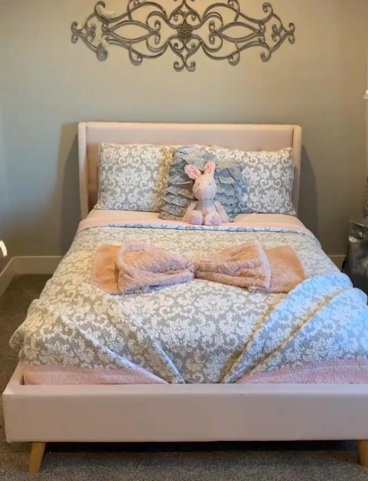 Neatly styled child's bedroom cleaned and organized